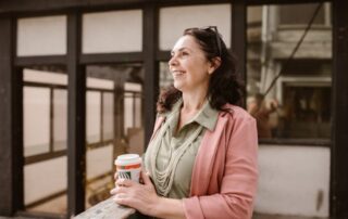 middle aged woman with coffee cup